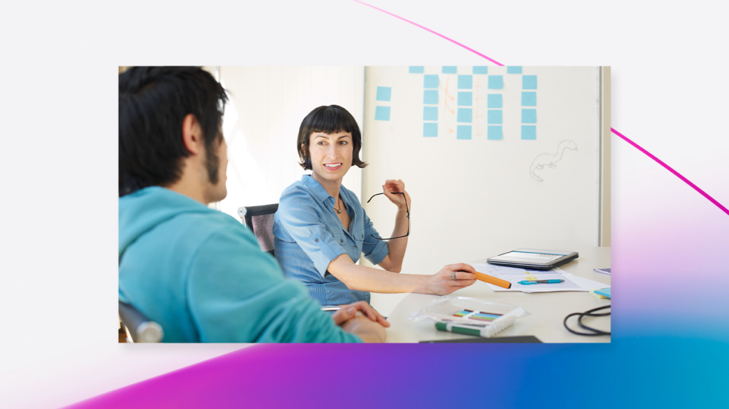 Developers meeting in front of a whiteboard